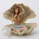 1764025276_Veronese-Design-Sereia-sentada-em-uma-escultura-de-concha